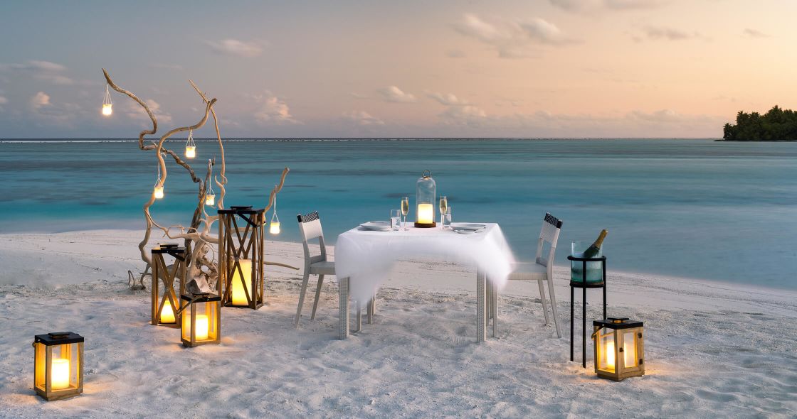 A Table And Chairs On A Beach