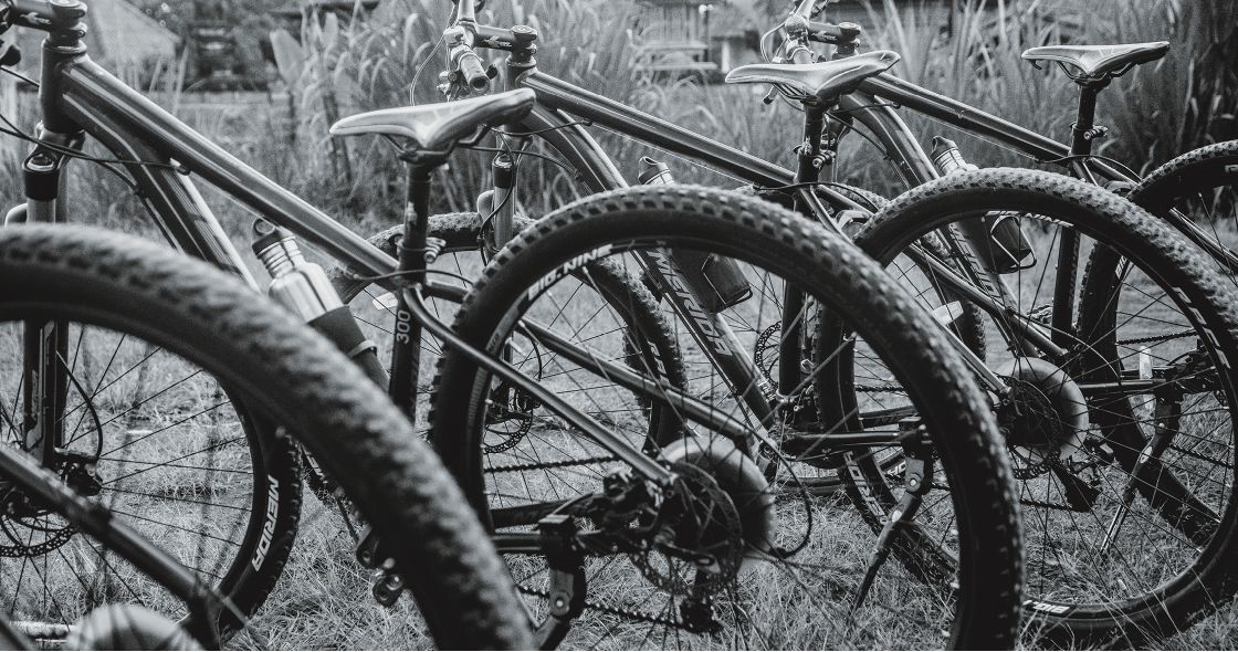 A Group Of Bicycles Parked Next To Each Other
