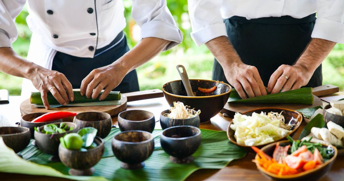 A Group Of Chefs Preparing Food
