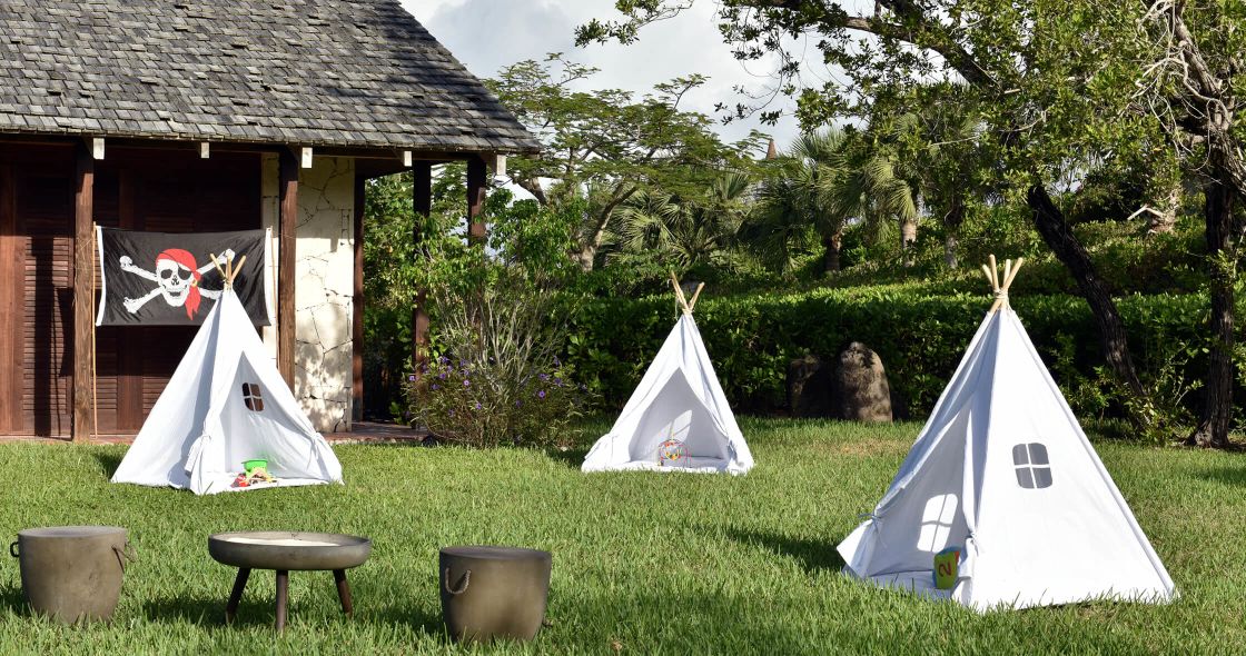 A Couple Of Tents In A Yard