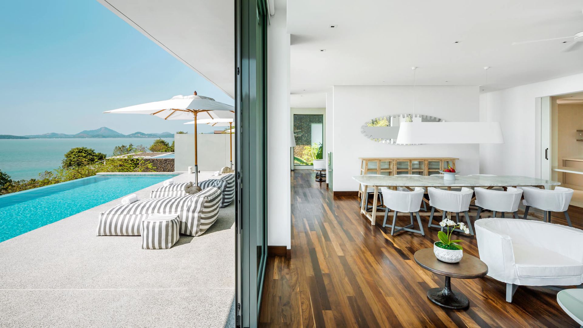 Point Yamu Pool Villa outdoor deck and living room - Image