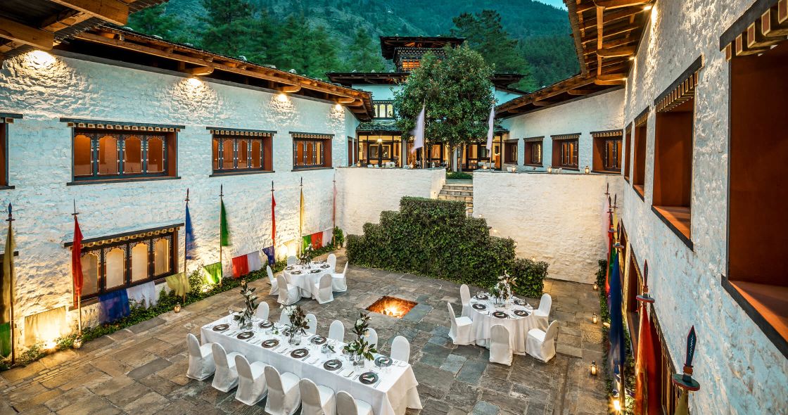 A Courtyard With Tables And Chairs
