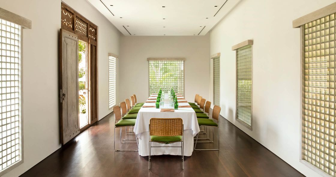 A Dining Room With A Table And Chairs