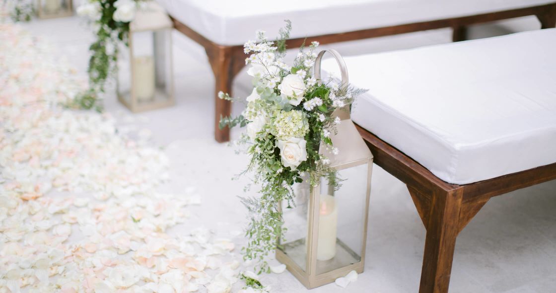 A Vase With White Flowers On A White Table