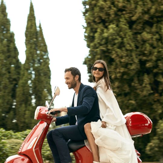 A Man And Woman On A Motorcycle