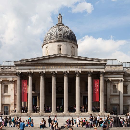 A Large Building With Columns And A Dome With The National Gallery In The Background