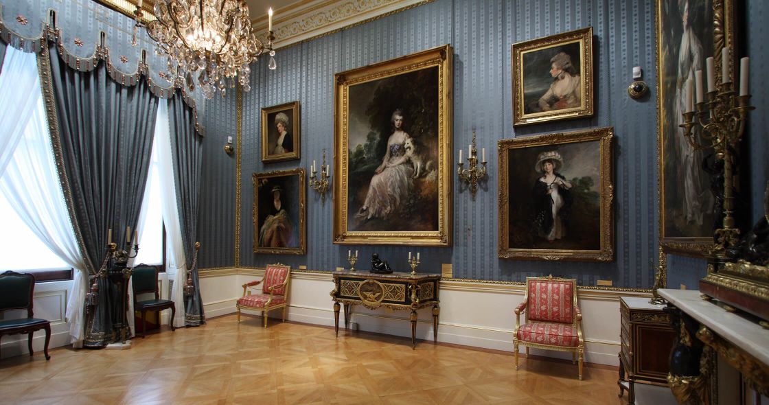 A Room With Paintings On The Wall