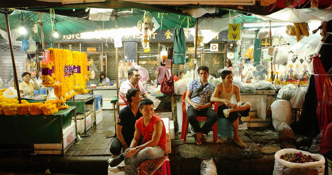 People Sitting In A Market