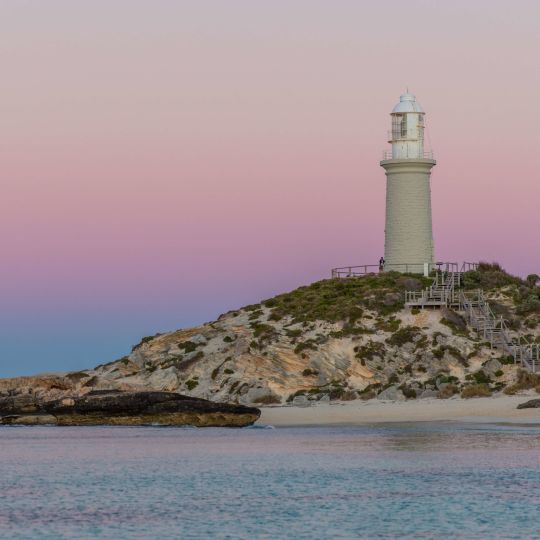 A Lighthouse On A Rocky Island