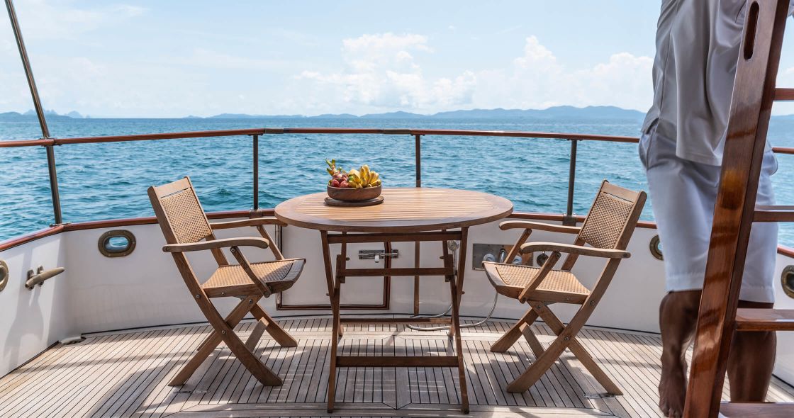 A Table And Chairs On A Boat