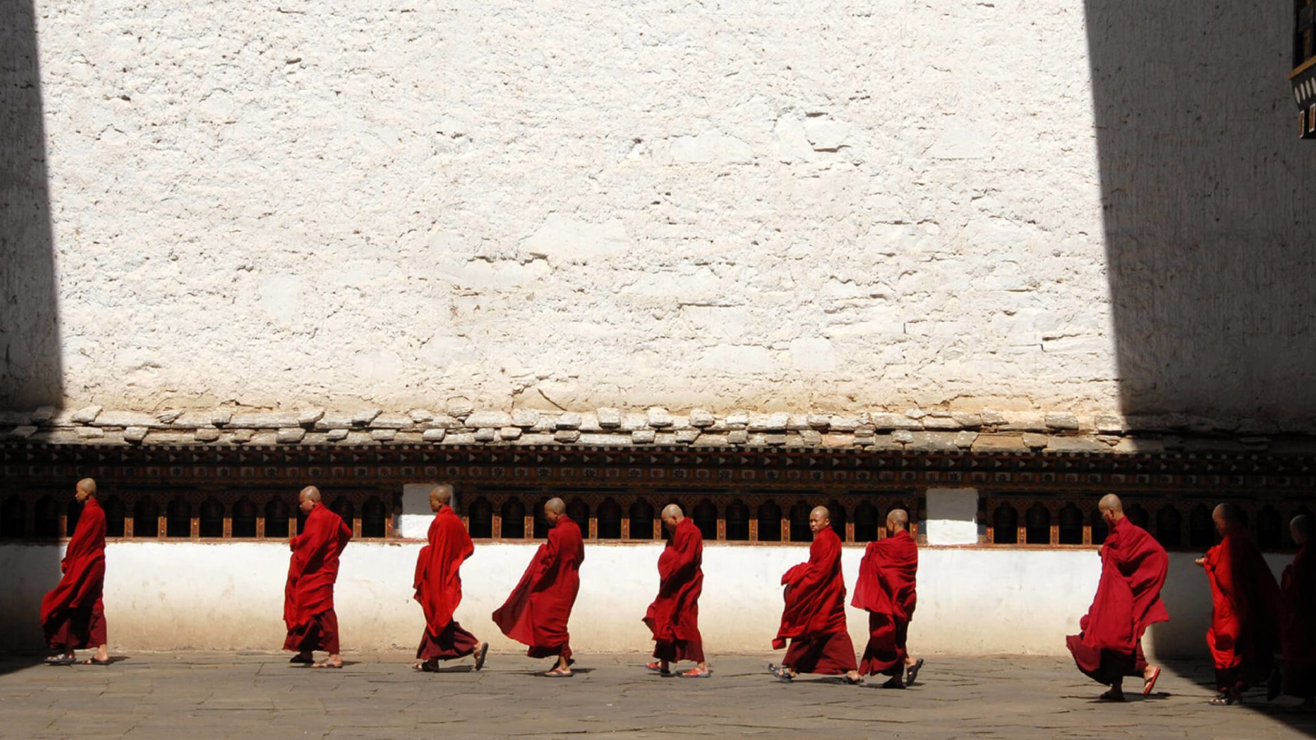 A Group Of People In Red Robes