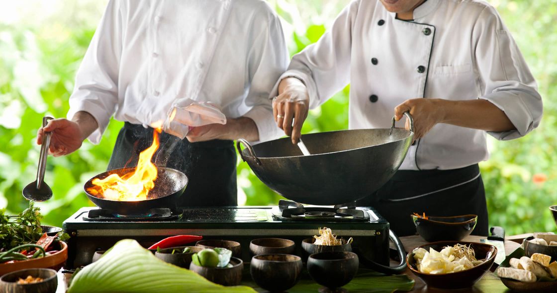 A Chef Cooking Food In A Wok