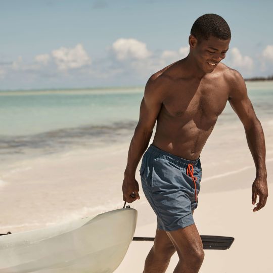 A Man Standing On A Beach