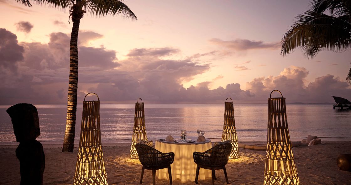 A Table And Chairs On A Beach