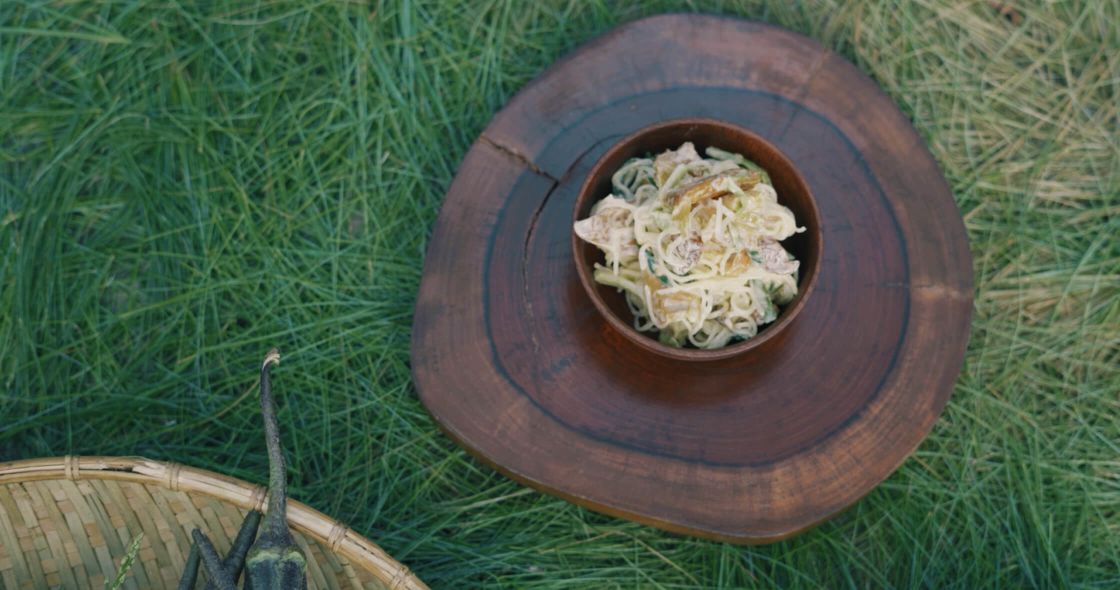 A Bowl Of Food On A Wood Surface