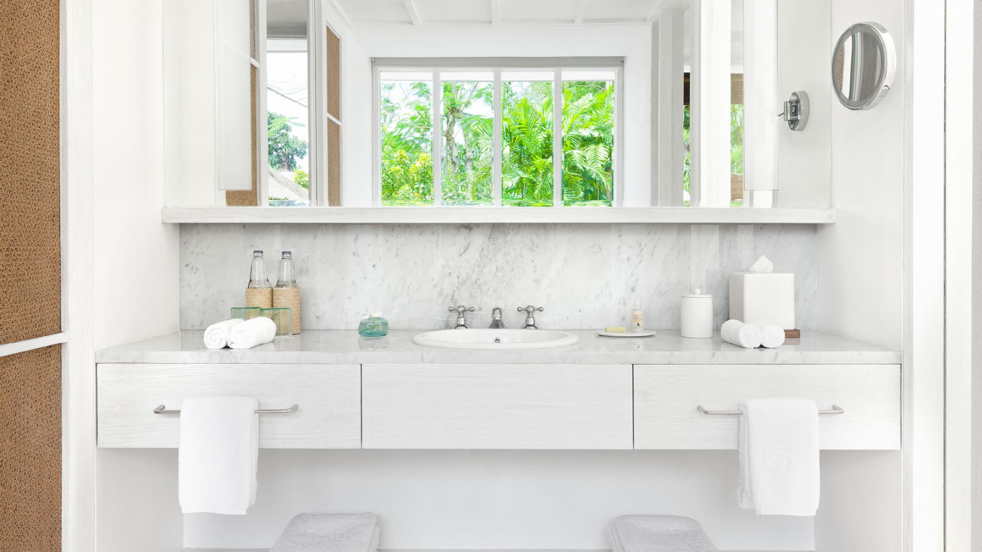 A Bathroom With White Cabinets - Image