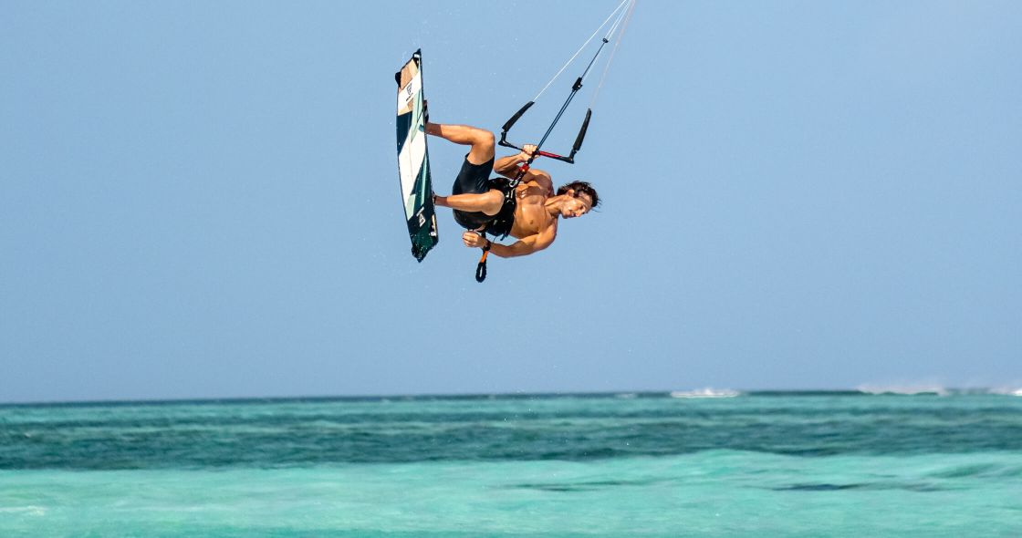 A Man Kite Surfing In The Sea
