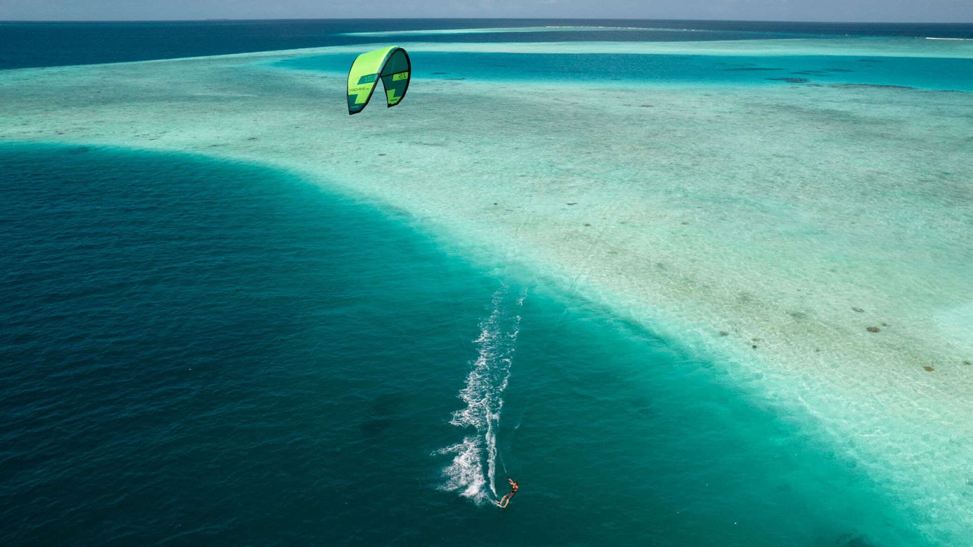 A Person Parasailing On The Ocean
