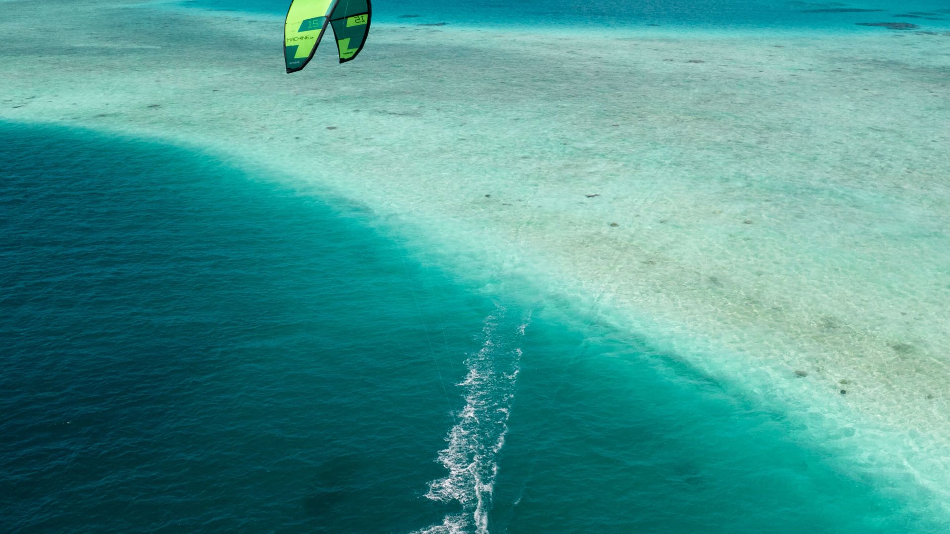 A Person Parasailing In The Ocean