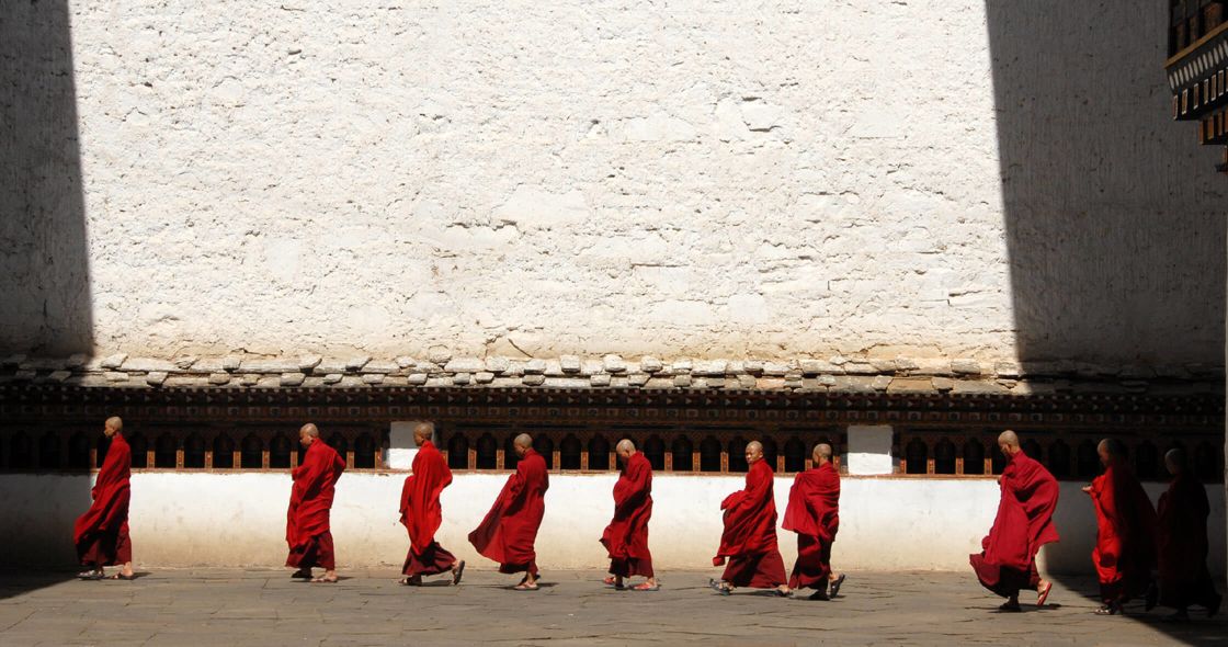 A Group Of People In Red Robes
