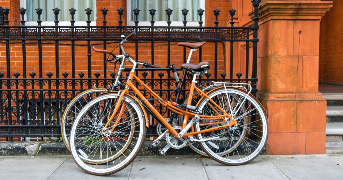 A Bicycle Parked On A Sidewalk