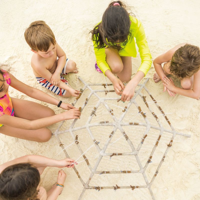 A Group Of Children Playing On A Sand Castle Image