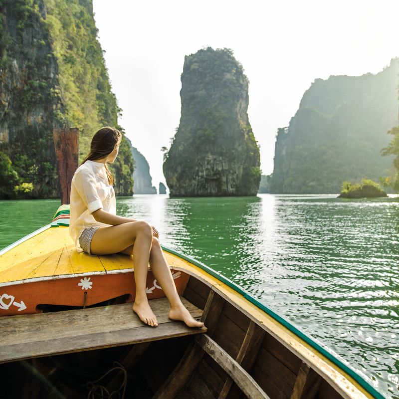 A Person Sitting On A Boat Image
