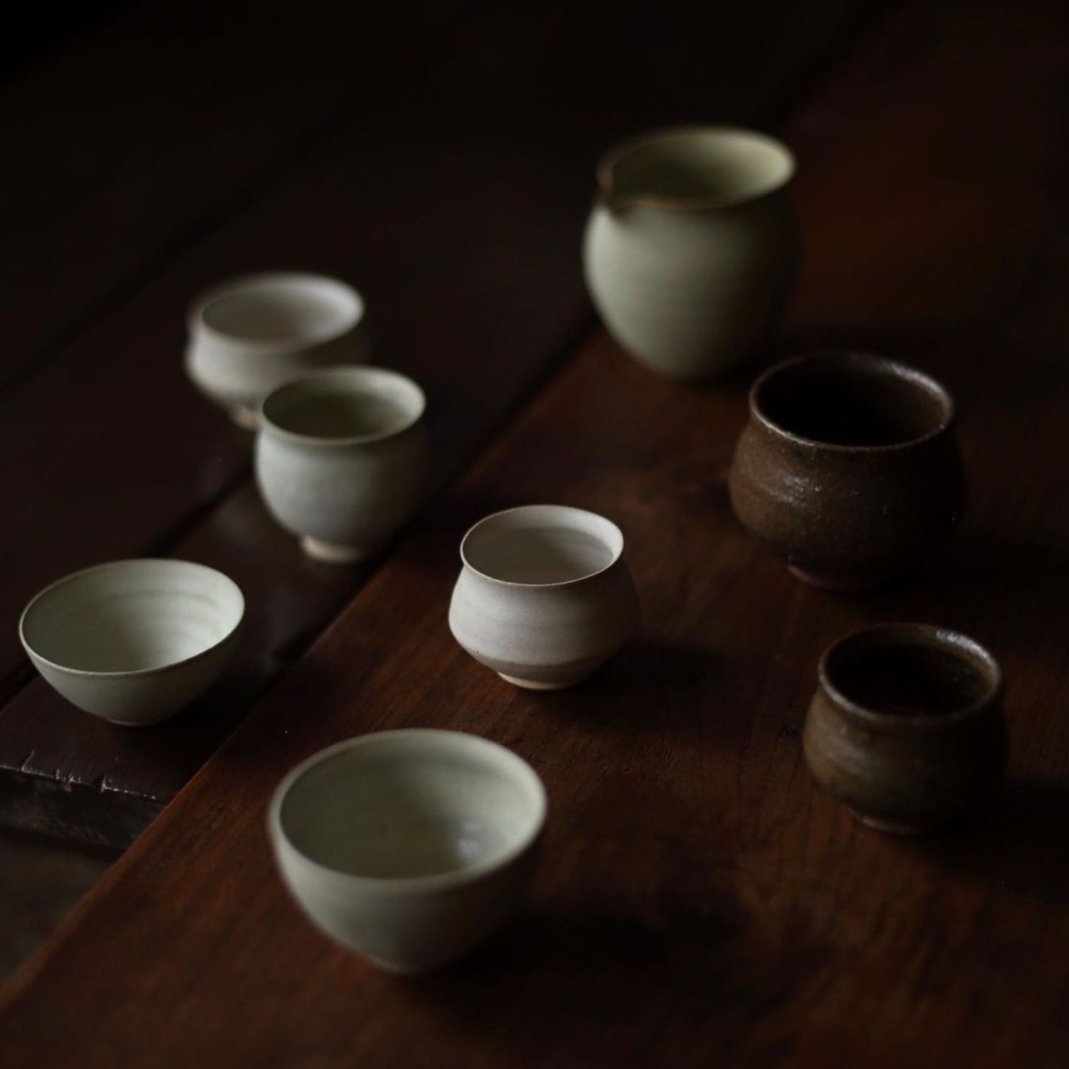 A Group Of Cups On A Table