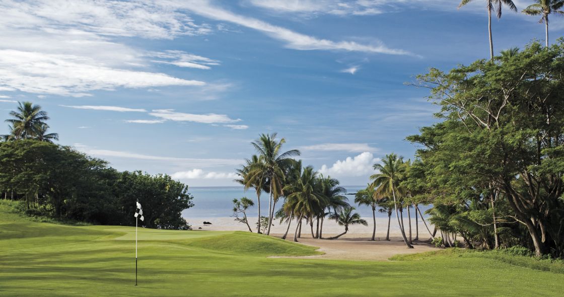 A Golf Course With Palm Trees